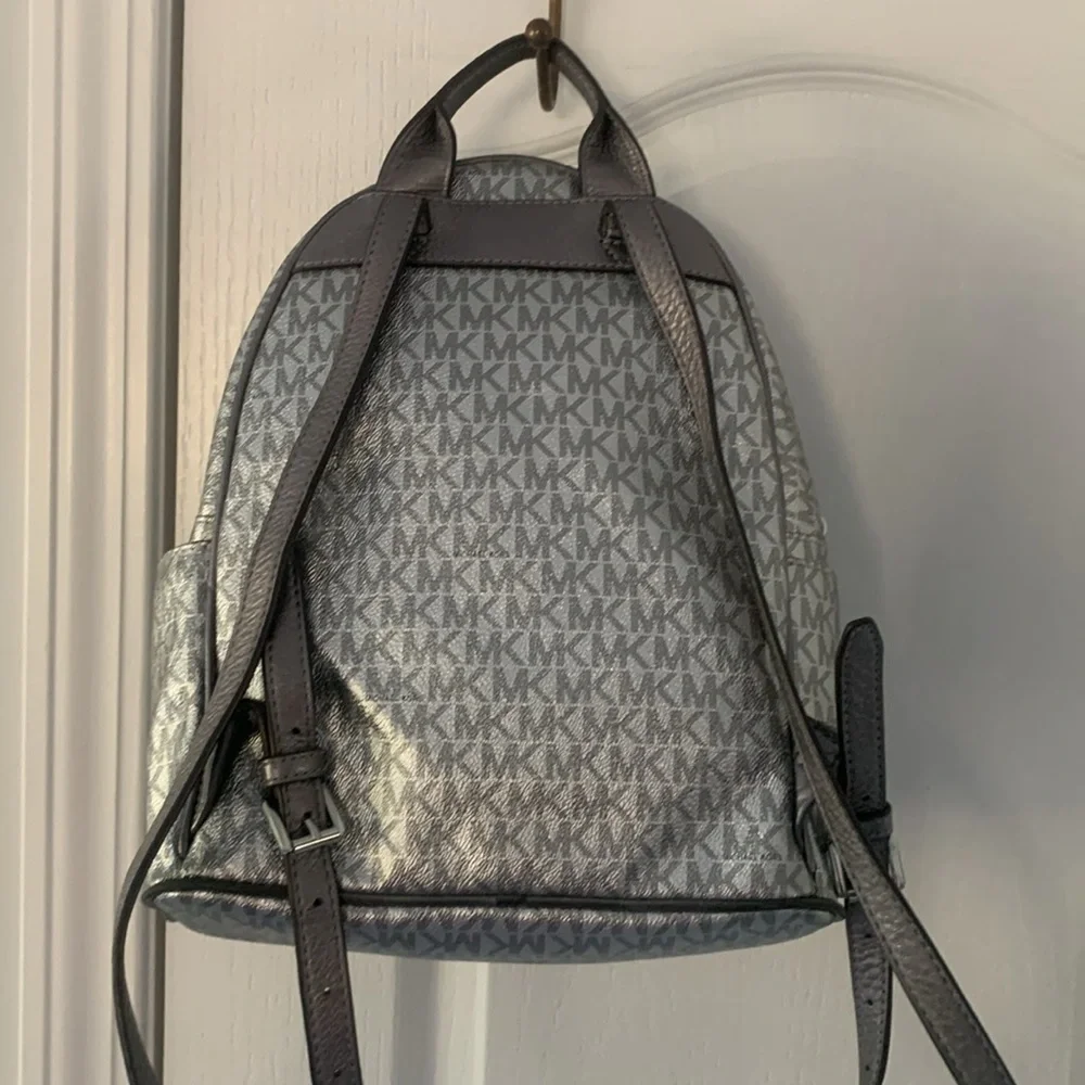 Michael Kors Silver shimmer Monogram Backpack shiny zipper leather compartments‎
